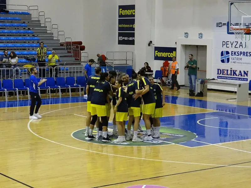 Fenerbahce players huddle on court in Istanbul before a EuroLeague Women game against Nadezhda Orenburg.